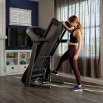 HZ20_LIFESTYLE_T101_female treadmill_folding_side-angle_lores
